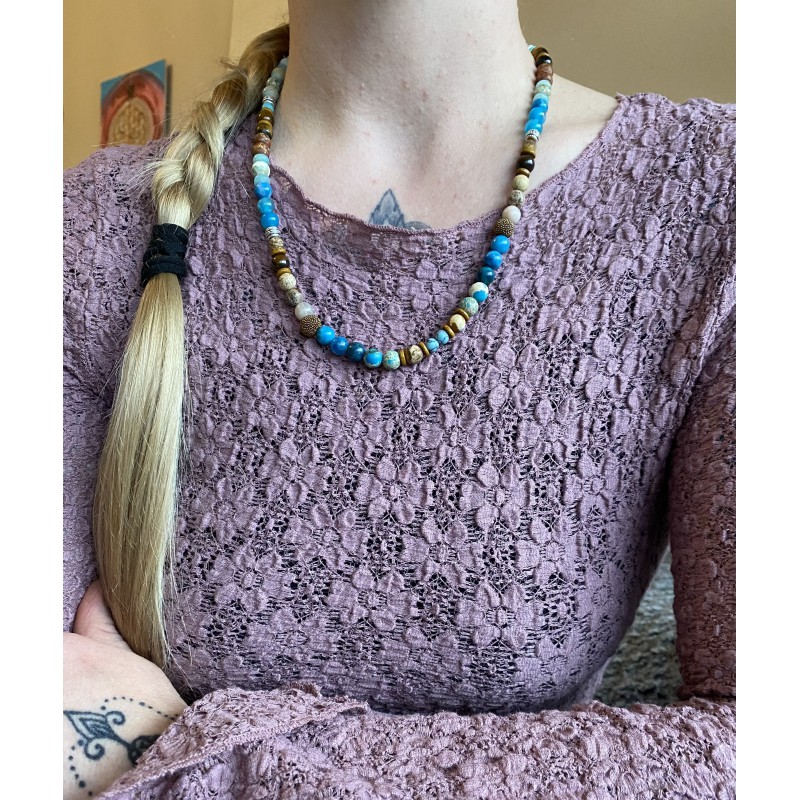 A beautiful gemstone necklace in shades of blue and brown