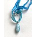 Larimar Anhänger an Stoffband in Blau