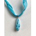 Larimar Anhänger an Stoffband in Blau
