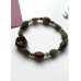 Armband „Leaves“ mit Blüte aus geschnitztem Tigerauge