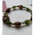 Armband „Leaves“ mit Blüte aus geschnitztem Tigerauge